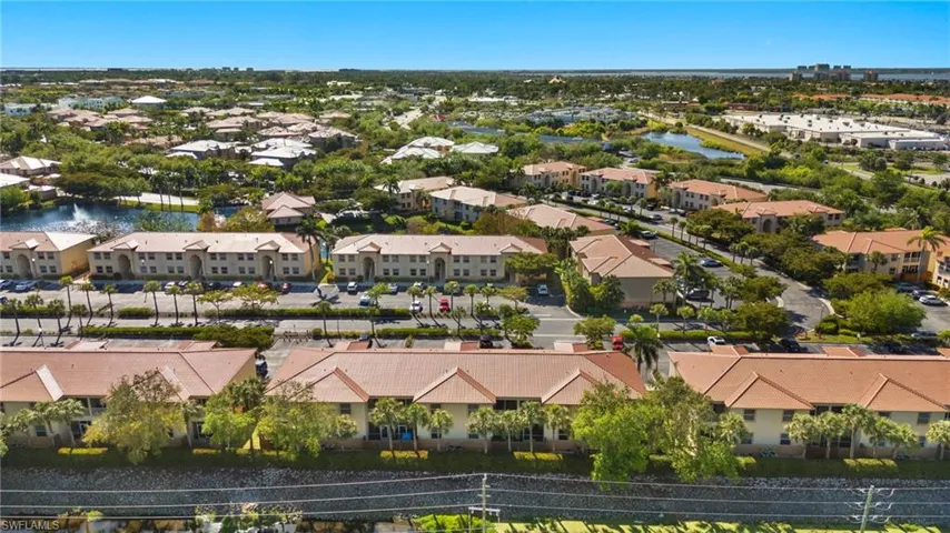 Drone / aerial view featuring a residential view and a water view