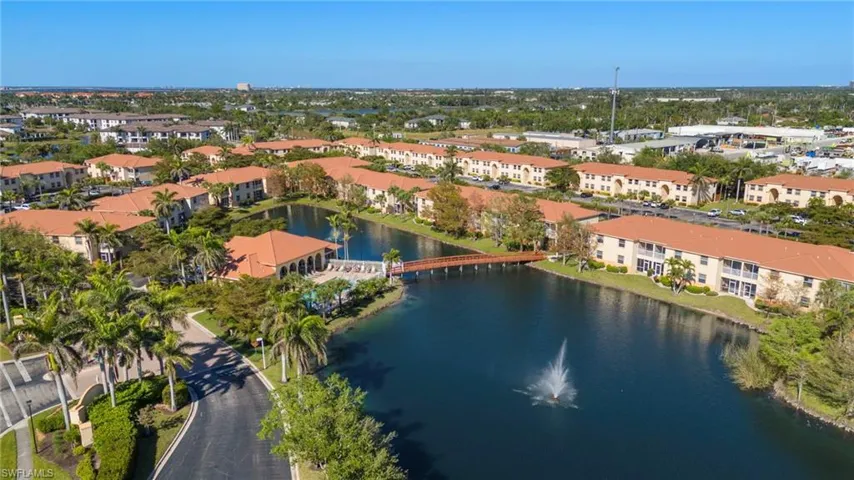 Birds eye view of property featuring a residential view and a water view