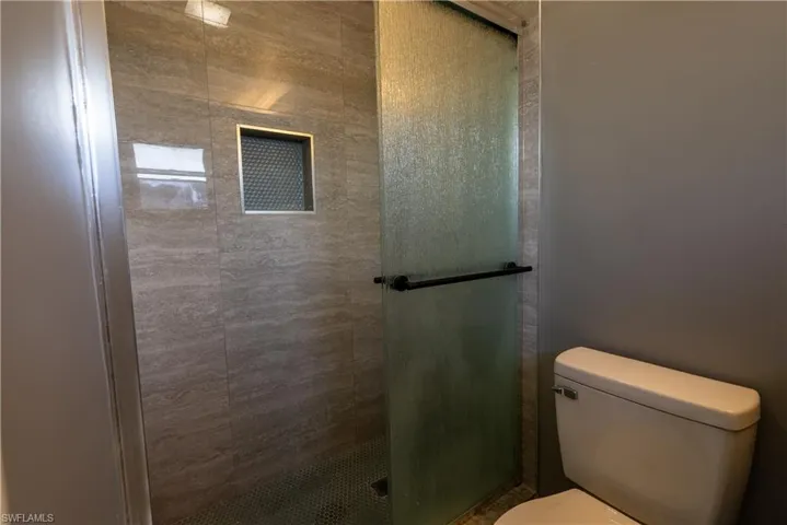 Full bath with a shower stall
