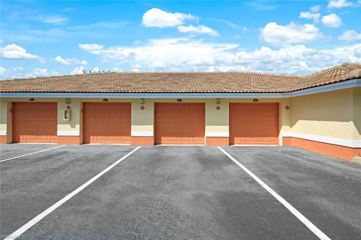 View of detached garage next to building