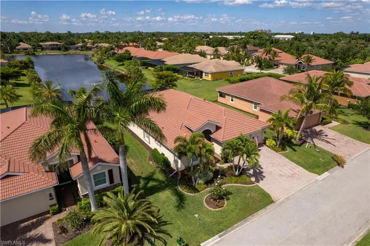Aerial perspective of suburban area featuring a large body of water
