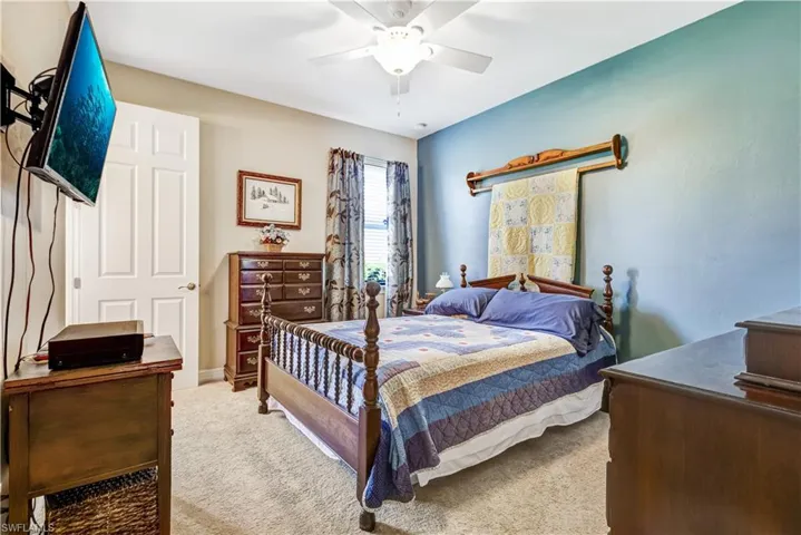 Bedroom featuring carpet flooring and a ceiling fan