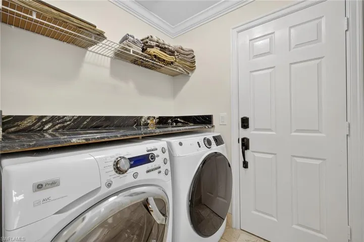 Laundry room with GE front load washer and dryer.