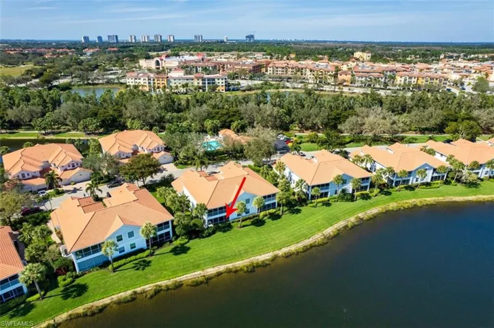 Aerial view featuring a water view and a residential view