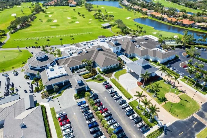 Aerial view with a water view and view of golf course