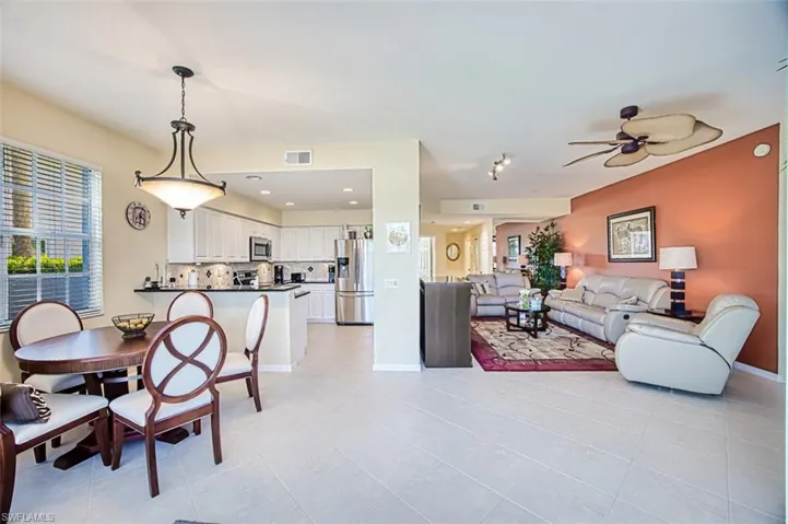 Dining room with light tile patterned floors, baseboards, visible vents, a ceiling fan, and recessed lighting