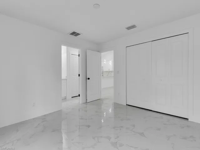 Spare room with visible vents and marble finish floor