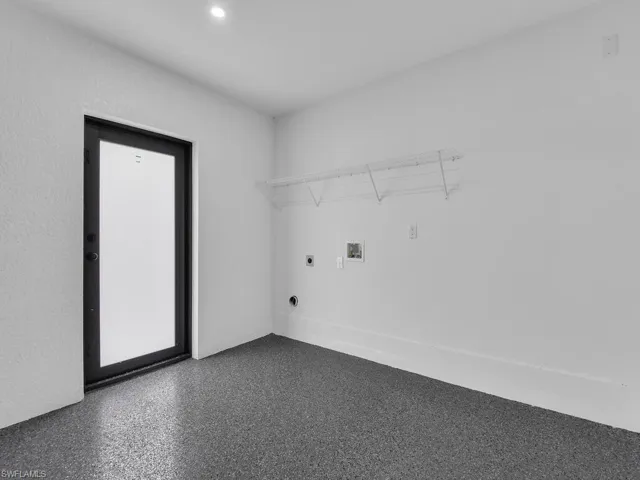 Washroom with recessed lighting, hookup for an electric dryer, washer hookup, and laundry area