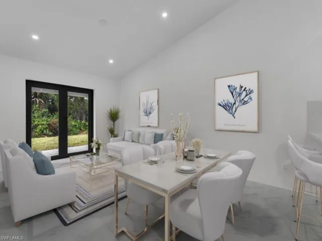 Dining room with recessed lighting and high vaulted ceiling