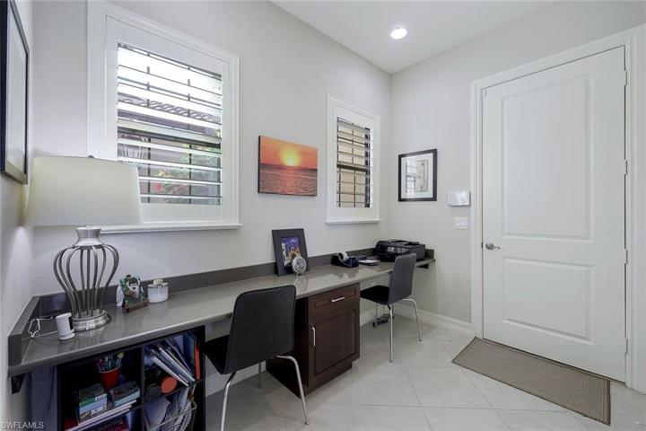Dedicated office and hobby area with two nice windows for natural light, and have Plantation Shutters.