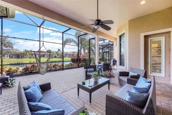 Large covered living areas with expanded brick pavers and screened area