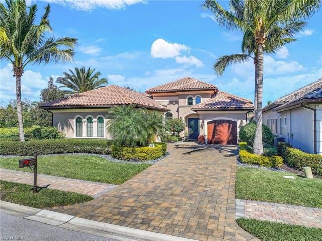 Beautiful manicured landscaping. Two car garage plus a single car garage. Brick paver drive. Note the paver sidewalks. These are found all around the community.