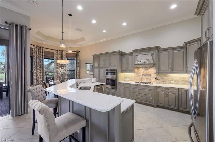 Upgraded cabinets, added pantry, gas cooktop