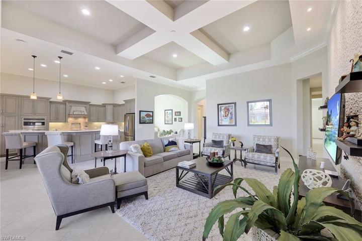 Great room with coffered ceilings, stacked stone feature wall. Great light.