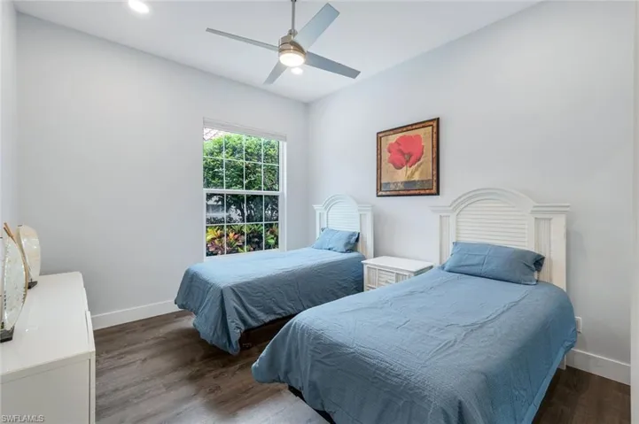 3rd Bedroom with baseboards, finished floors, and ceiling fan
