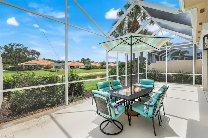 Lanai with a water view & outdoor dining. Lake is Extremely Low due to current drought!!!