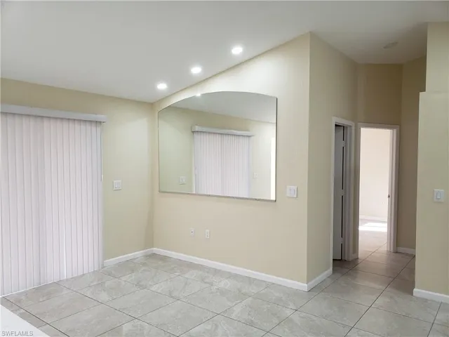 Spare room with recessed lighting and light tile patterned floors