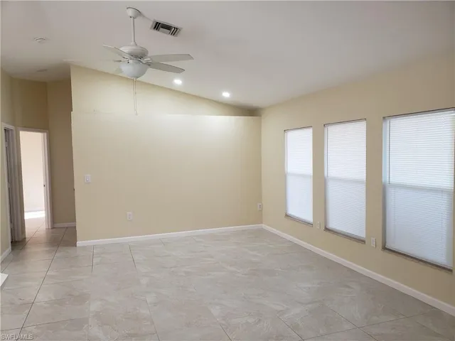 Unfurnished room with a ceiling fan, lofted ceiling, and recessed lighting