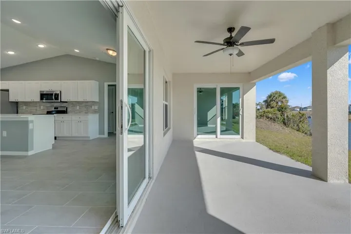 View of patio / terrace with ceiling fan and area for grilling