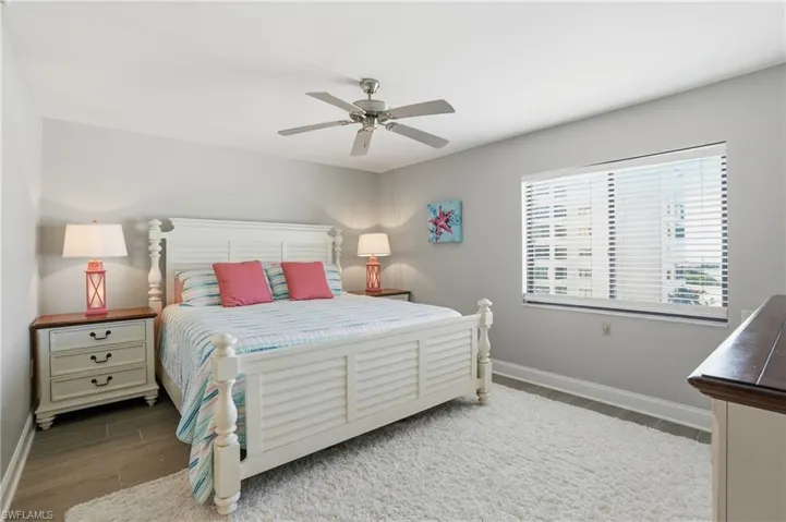 Bedroom featuring wood finished floors and a ceiling fan