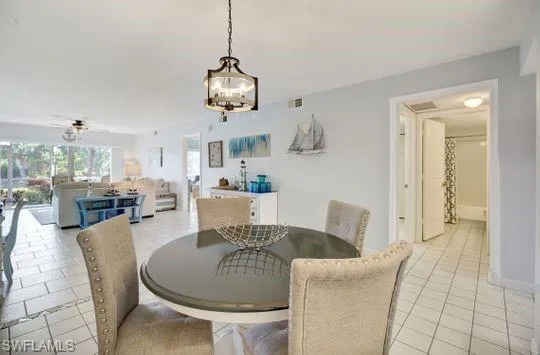 Recessed lighting, tiled flooring, and a ceiling fan with light fixture