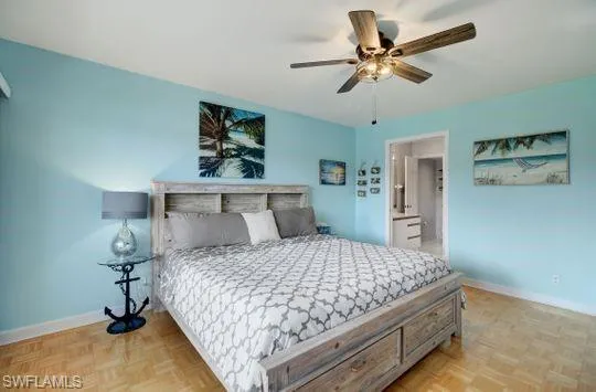 Light wood-finish flooring with a decorative ceiling fan
