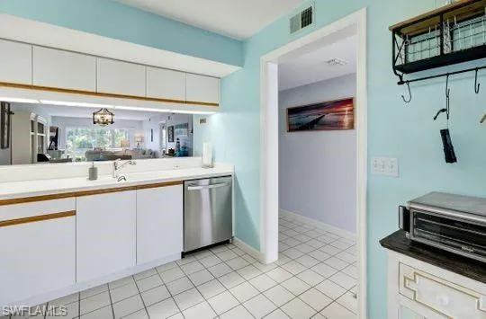 White cabinetry with wood-finish accents