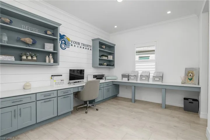 You'll LOVE this custom office space with built in shelving, decorative shiplap, plenty of counter space and cabinets for storage. Conveniently located just off the butler pantry/coffee station and kitchen.