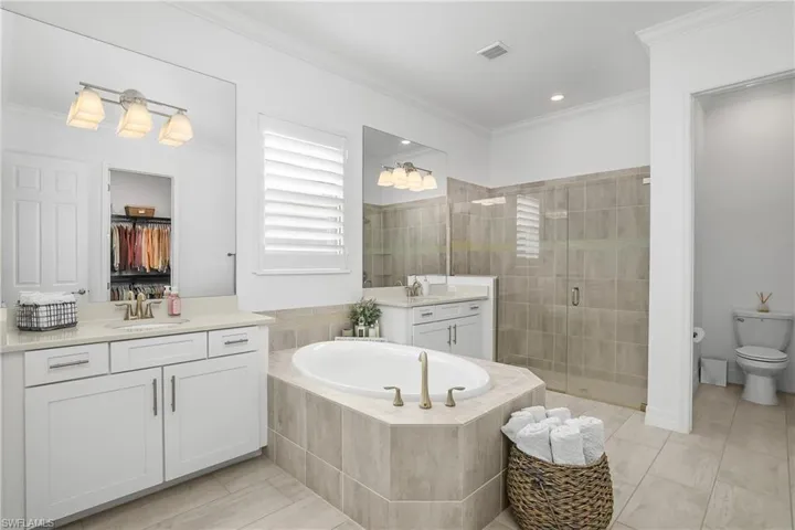 Owner bath includes entry to HUGE walk-through closet, giving you easy access to the laundry room.