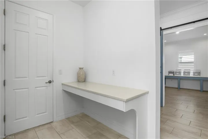 Garage entry way with convenient drop zone.