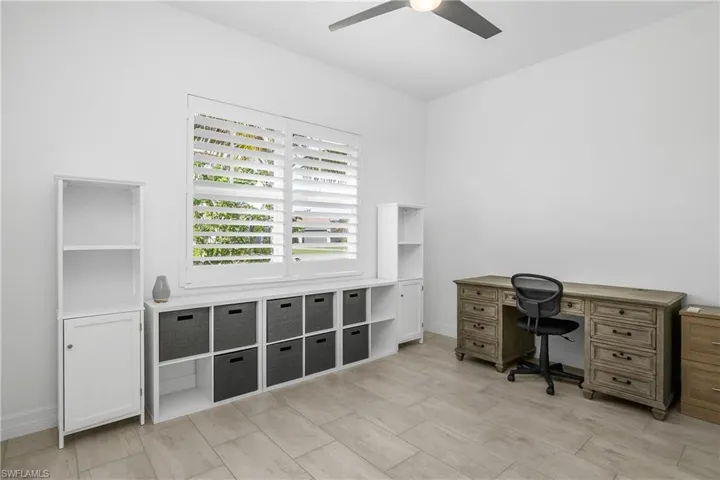 Bedroom #4 is located at the front of the home and shares a private bath with bedroom #3.