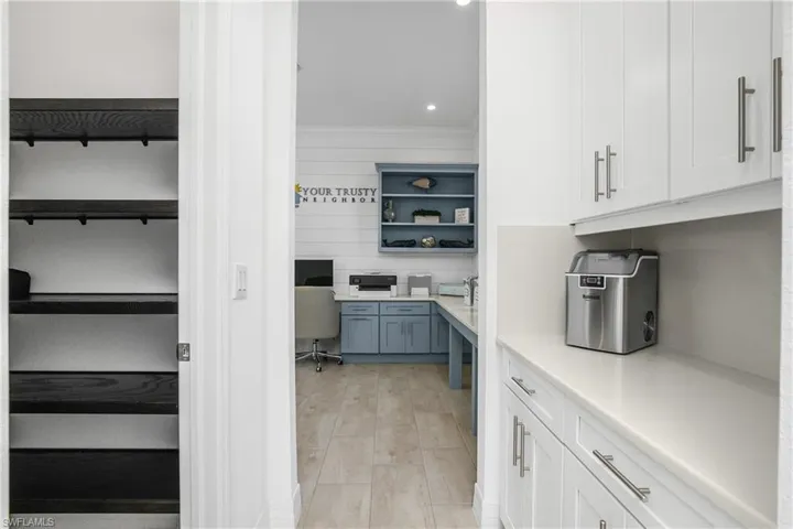 You'll LOVE this additional butler pantry/coffee station which is located between the kitchen and office. It provides additional cabinet and counter space, as well as a large walk-in pantry.