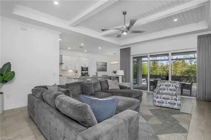 Open floor plan overlooking the pool area, great for entertaining guests and provides a seamless transition from indoor to outdoor living.