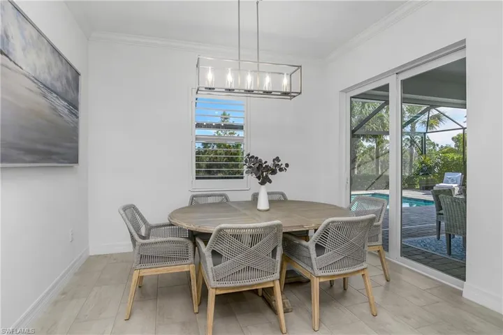 Enjoy dining with a view, as this family dining space is just off the kitchen with great views of the pool and private preserve beyond.