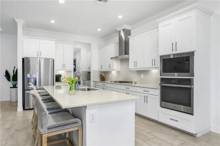 You'll enjoy plenty of cabinet space and a fabulous butler pantry/coffee station with a large walk-in pantry.
