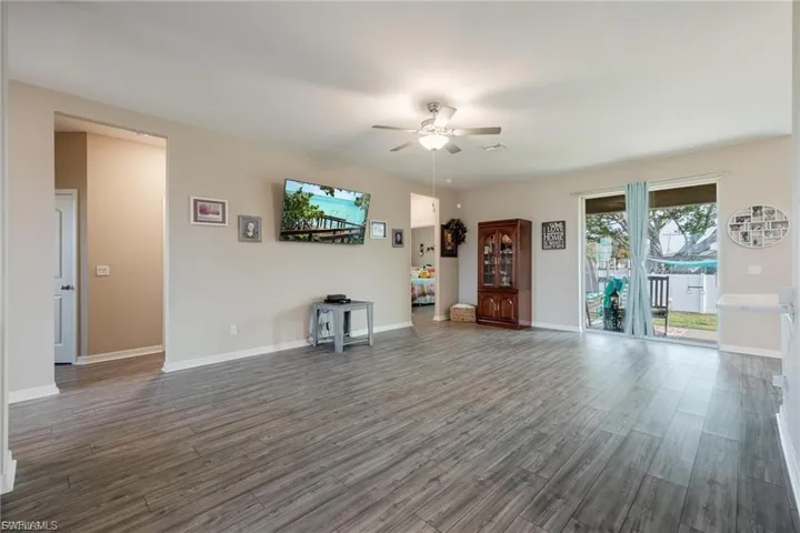 Kitchen with healthy amount of natural light, appliances with stainless steel finishes, light countertops, light wood-type flooring, and recessed lighting