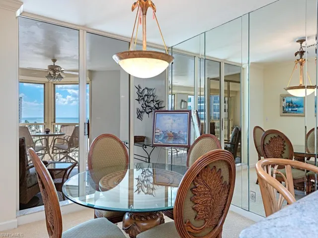 Dining space with plenty of natural light, ceiling fan, and a water view