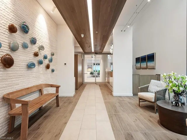 Building entrance lobby with wood ceiling