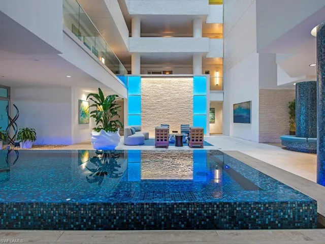 Atrium lobby with water feature and recessed lighting