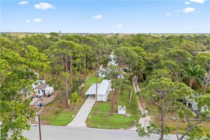 Private retreat with beautiful trees and a home that feels much larger than actual square footage.