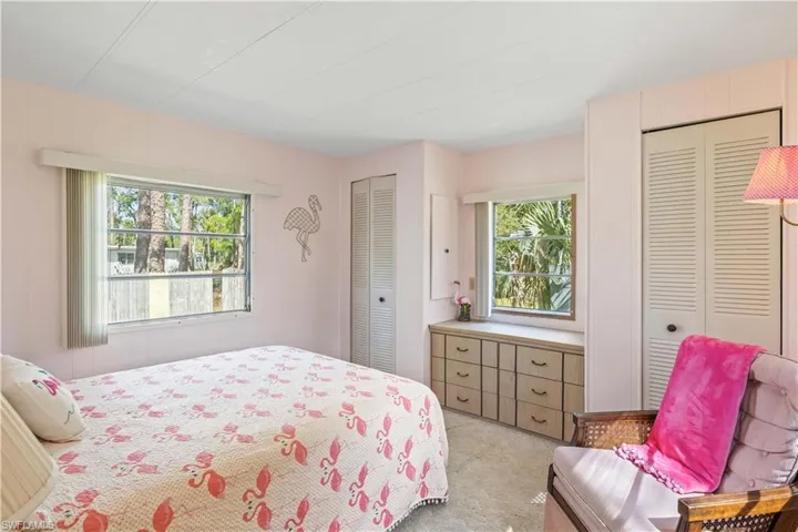 Guest bedroom with double closets and built in drawer!  More of that beautiful natural light!