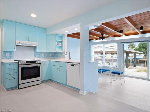 Retro-designed kitchen with views to the water through the Florida room
