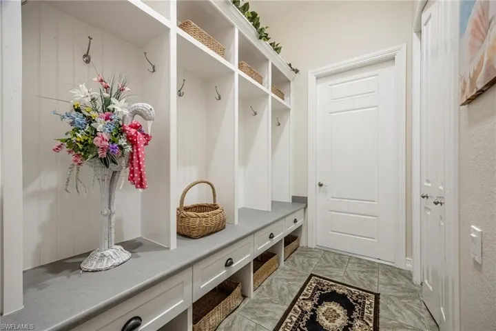 Mudroom featuring light tile patterned floors