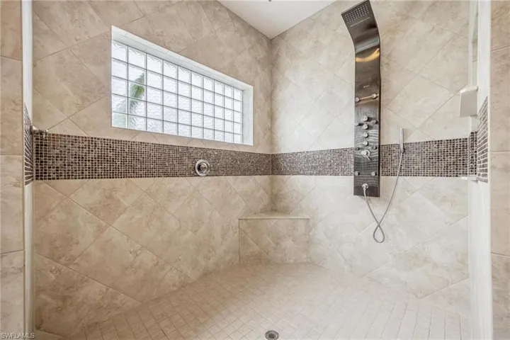 Bathroom featuring a tile shower