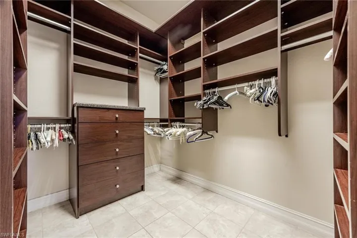 Spacious closet featuring light tile patterned floors