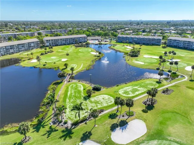 Aerial view of a local golf course and a nearby body of water