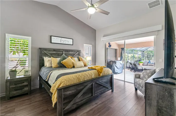 Primary Bedroom with pocket sliders overlooking the lanai and pool.