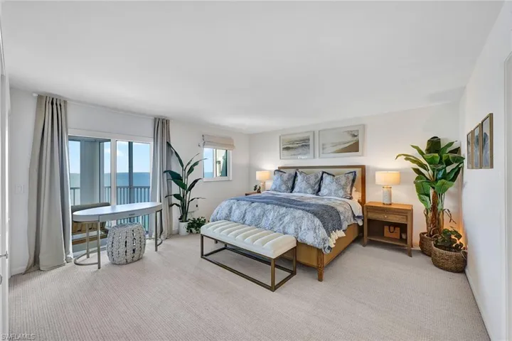 The king size primary bedroom suite has impact doors opening to the terrace