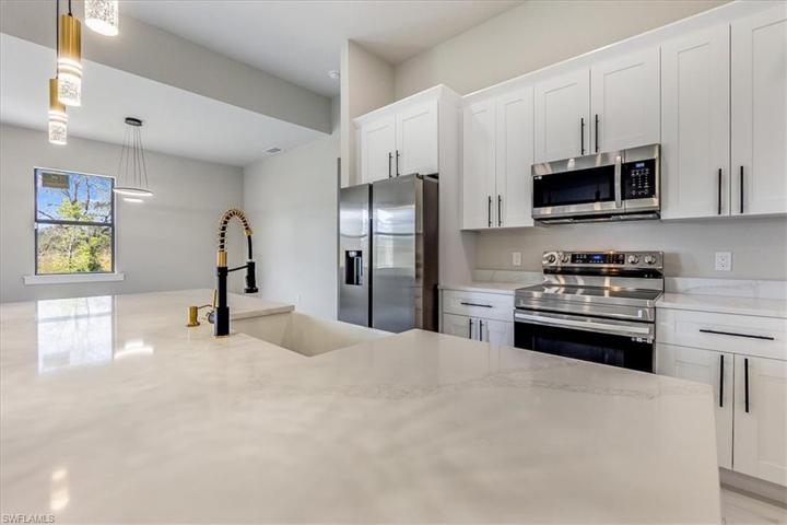 Bright and airy kitchen with stainless steel appliances.