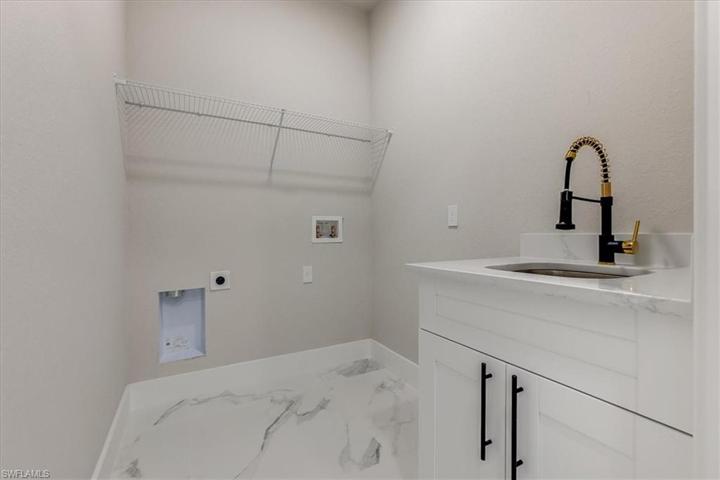 Spacious laundry room with sink!!!